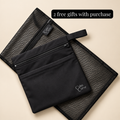 A black mesh zip pouch with a smaller black fabric zip pocket placed on top, both branded with the Calm Curve logo, on a light beige background. A black text banner at the top reads '2 free gifts with purchase'.